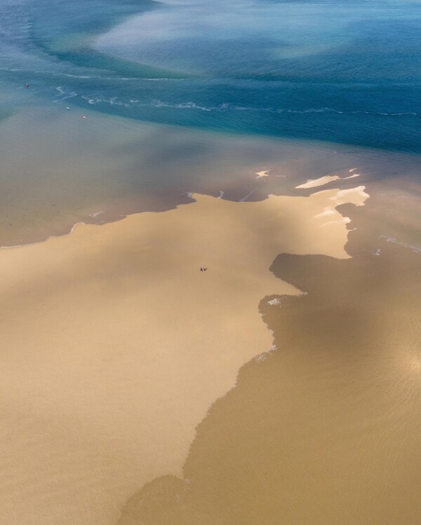 Tranquil at ground level, breathtaking from the sky! π Watching the rising tide gently embracing the final grains of sand along Inverloch's foreshore is truly captivating. ππ DestinationInverloch